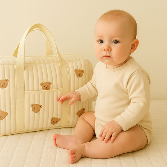 bebe assis surpris sac a langer ours olipin carrousel