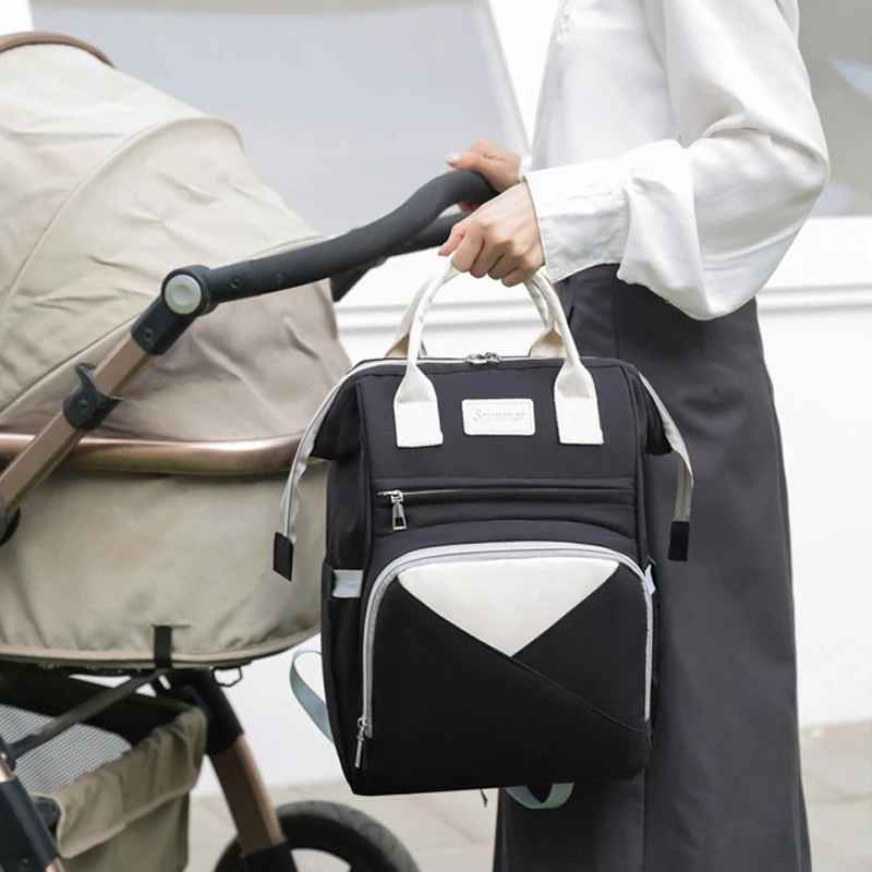 sac à dos à langer noir poussette rosace carrousel