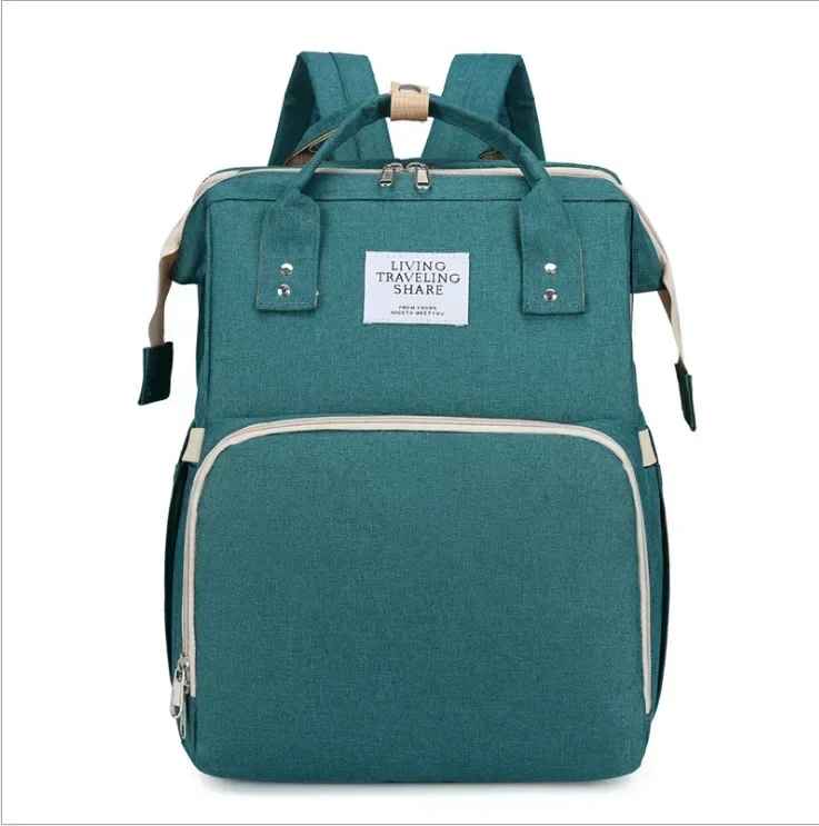 sac à dos à langer vert kodola carrousel